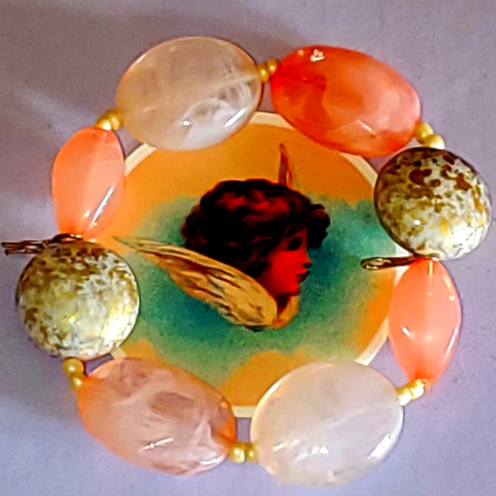 Rose and gold flecked quartz bracelet.